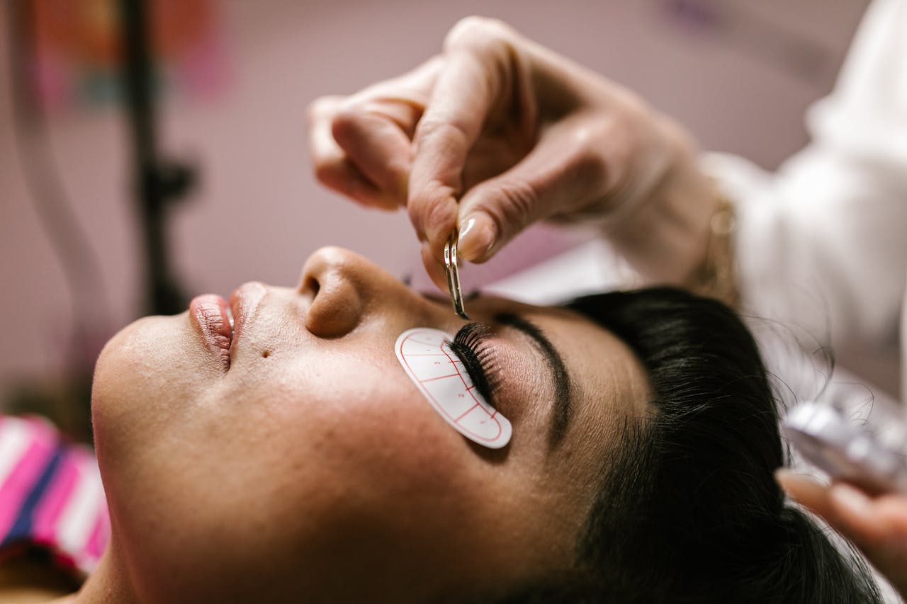 Crafting Captivating Headlines: Your awesome post title goes here Close-up of a woman receiving eyelash extensions at a beauty salon.